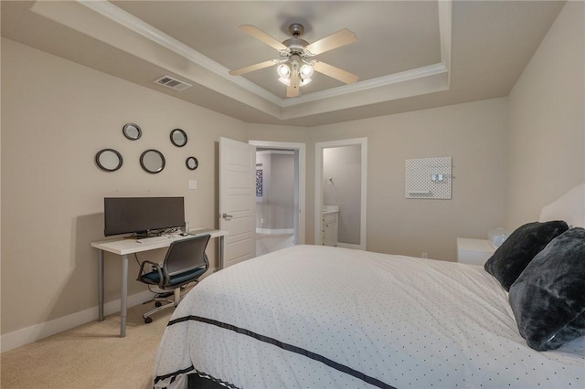 bedroom with light carpet, visible vents, a tray ceiling, and ornamental molding