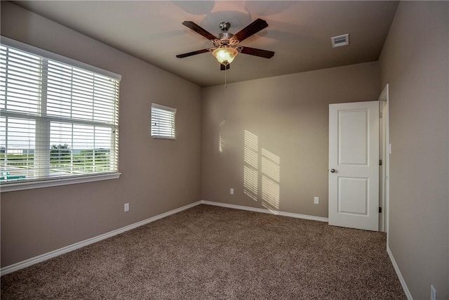 empty room with carpet floors and ceiling fan