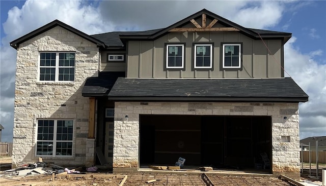 5323 Lyle Pl, Bryan, TX 77807 - view of front of home featuring board and batten siding, stone siding, and an attached garage