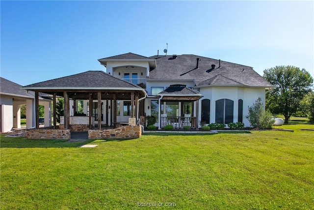 7576 River Ridge Drive, College Station, TX 77845 - back of house with a yard, stucco siding, and a patio area