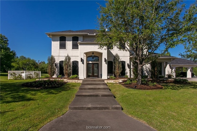 7576 River Ridge Drive, College Station, TX 77845 - mediterranean / spanish house with french doors, a front yard, and stucco siding