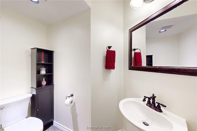 7576 River Ridge Drive, College Station, TX 77845 - bathroom with a sink and toilet