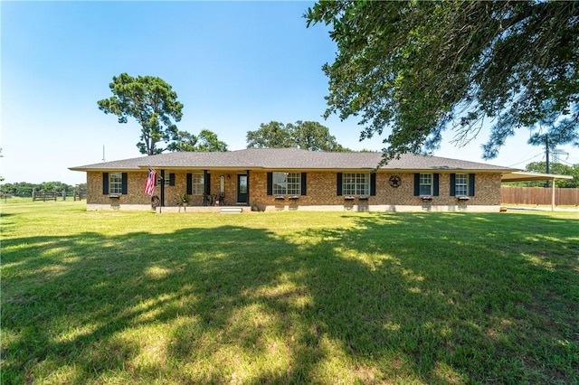 ranch-style home with a front yard