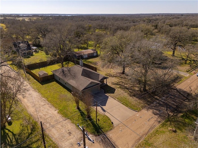 drone / aerial view featuring a wooded view