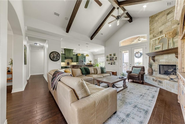 5149 Mandarin Way, College Station, TX 77845 - living area featuring beamed ceiling, a ceiling fan, dark wood finished floors, a fireplace, and high vaulted ceiling