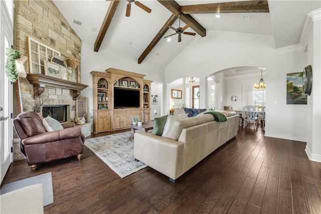 5149 Mandarin Way, College Station, TX 77845 - living room featuring ceiling fan, arched walkways, a fireplace, dark wood-style floors, and high vaulted ceiling