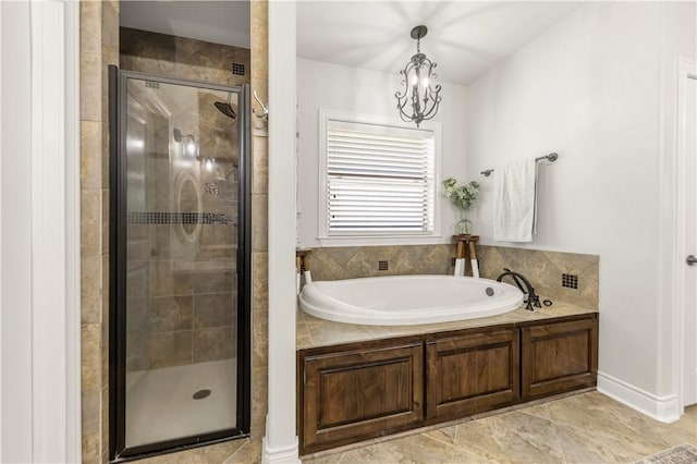 5149 Mandarin Way, College Station, TX 77845 - bathroom with a bath, a shower stall, and a chandelier