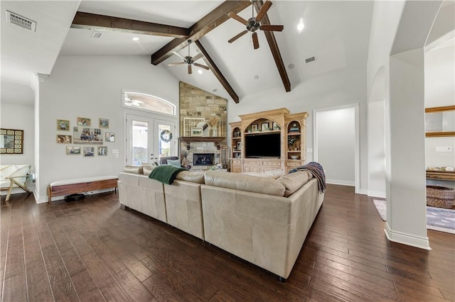 5149 Mandarin Way, College Station, TX 77845 - living area featuring ceiling fan, dark wood-type flooring, a stone fireplace, beamed ceiling, and high vaulted ceiling