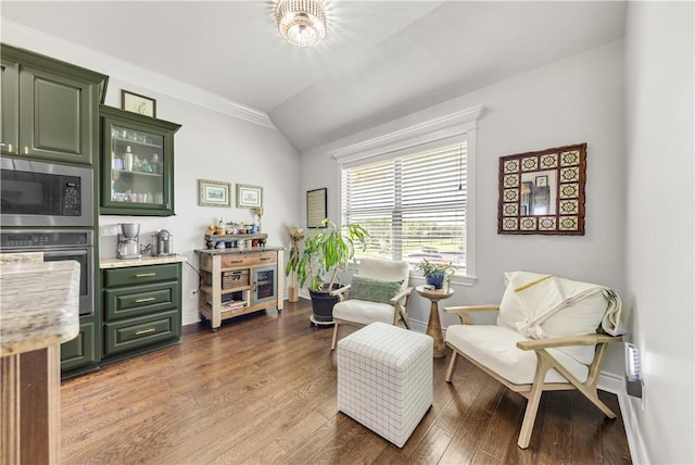 5149 Mandarin Way, College Station, TX 77845 - living area featuring vaulted ceiling, wood finished floors, and ornamental molding