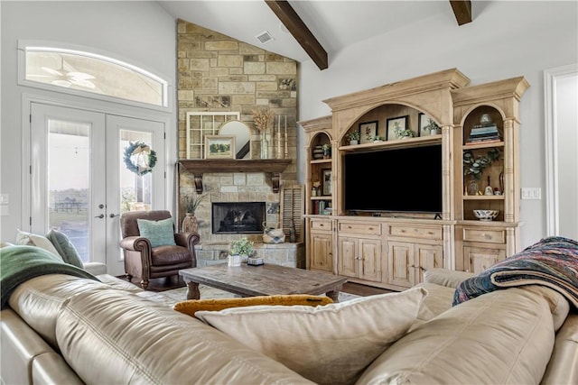 5149 Mandarin Way, College Station, TX 77845 - living area featuring healthy amount of natural light, a stone fireplace, and french doors