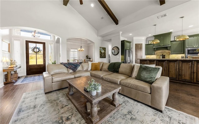 5149 Mandarin Way, College Station, TX 77845 - living area featuring arched walkways, a chandelier, beam ceiling, wood-type flooring, and recessed lighting