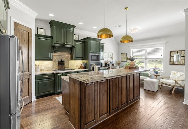 5149 Mandarin Way, College Station, TX 77845 - kitchen featuring stainless steel appliances, green cabinets, dark wood-style flooring, decorative backsplash, and crown molding