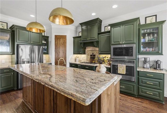 5149 Mandarin Way, College Station, TX 77845 - kitchen with appliances with stainless steel finishes, green cabinets, dark wood finished floors, tasteful backsplash, and light stone countertops