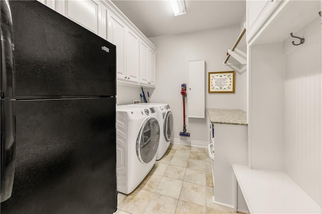 5149 Mandarin Way, College Station, TX 77845 - laundry room with washing machine and clothes dryer, cabinet space, and light tile patterned floors