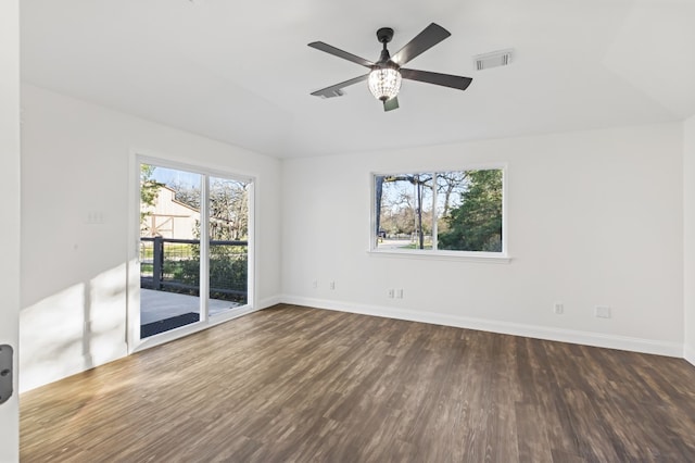 empty room with ceiling fan and dark wood-type flooring