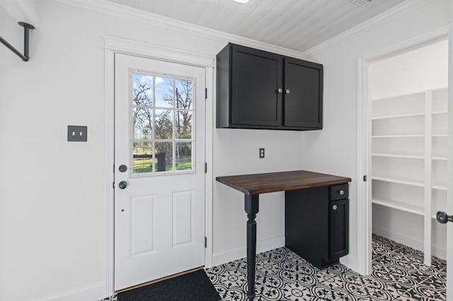 interior space with crown molding