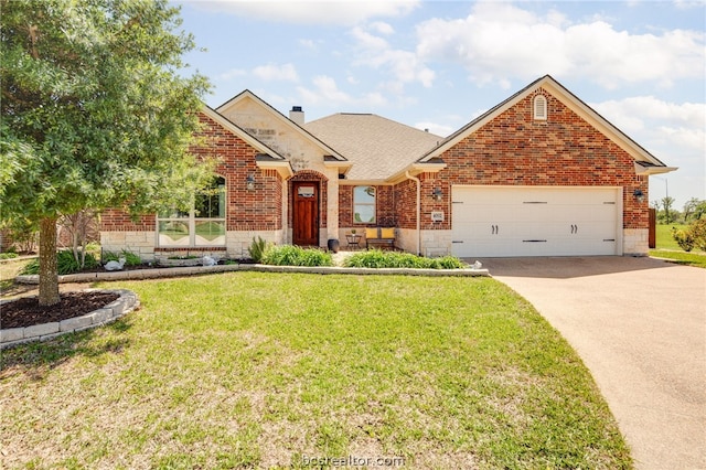 view of front of property featuring a front yard and a garage