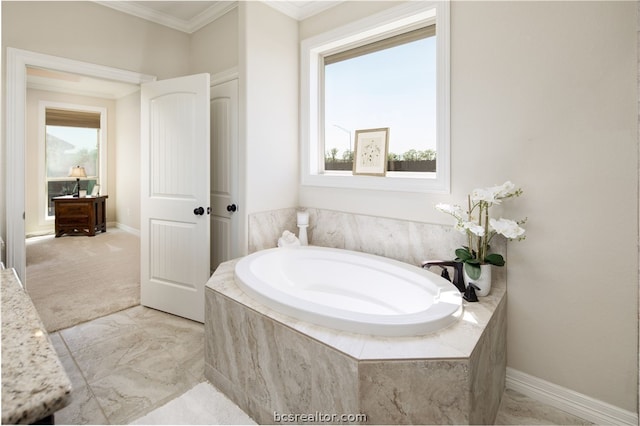 bathroom with crown molding and tiled bath