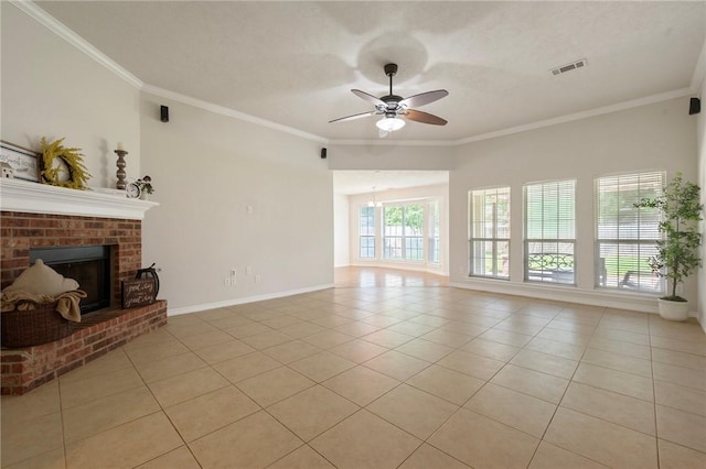 unfurnished living room with ceiling fan, visible vents, light tile patterned flooring, a brick fireplace, and crown molding
