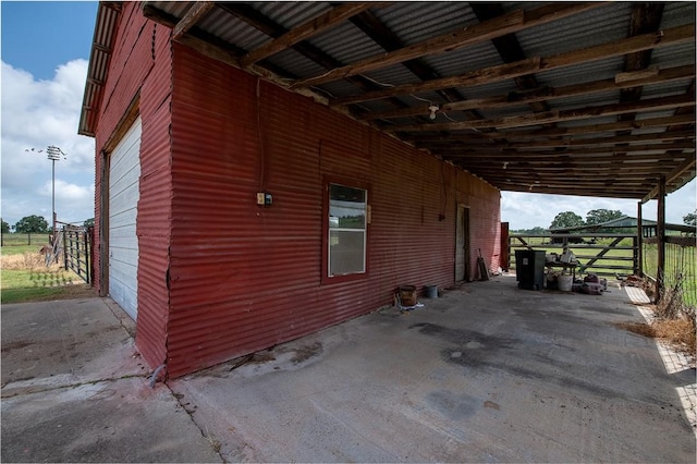 4454 Fm 60 E, Somerville, TX 77879 - view of home's exterior featuring an attached carport, an outdoor structure, and an exterior structure