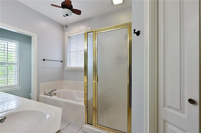 bathroom with tile patterned floors, vanity, separate shower and tub, and ceiling fan