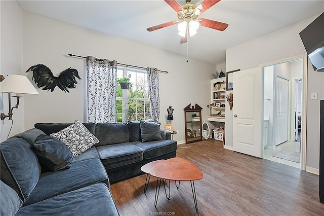 living room with hardwood / wood-style flooring and ceiling fan