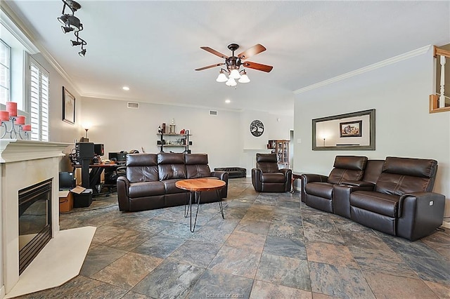 living room with ceiling fan and ornamental molding