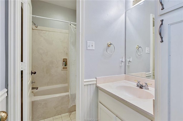 bathroom featuring tile patterned flooring, shower / bath combo, and vanity