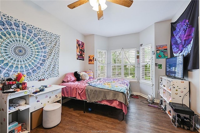 bedroom with ceiling fan and dark wood-type flooring