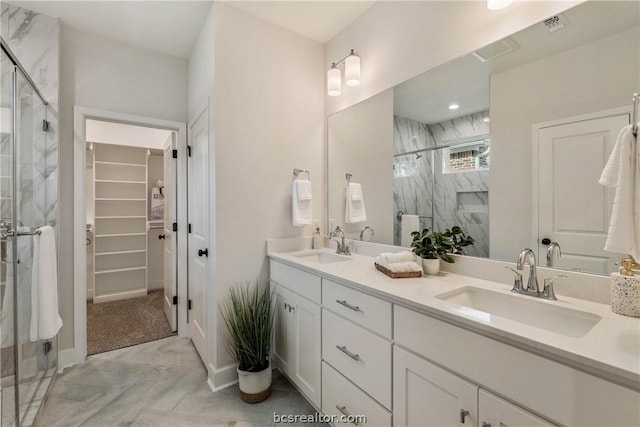 bathroom featuring vanity and an enclosed shower