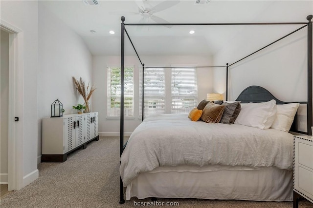 carpeted bedroom featuring ceiling fan and lofted ceiling