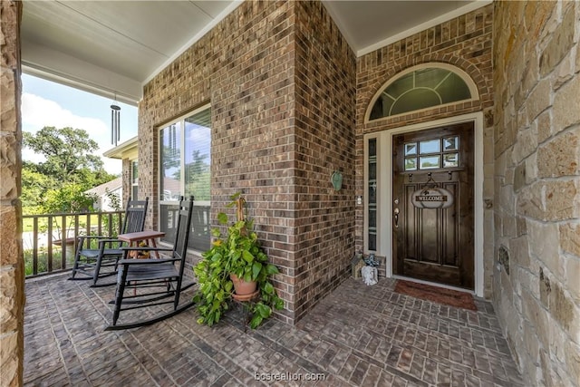 entrance to property with covered porch