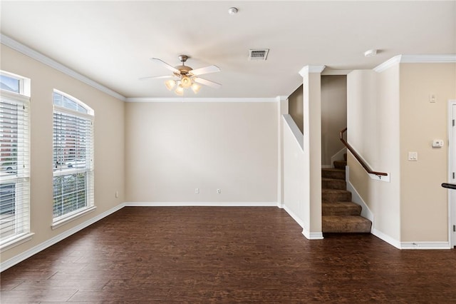 unfurnished room featuring ceiling fan, ornamental molding, and dark wood-type flooring