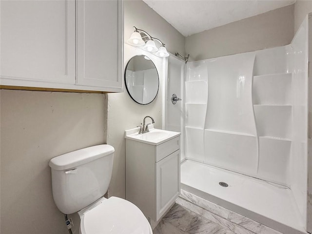bathroom featuring a shower, vanity, toilet, and marble finish floor