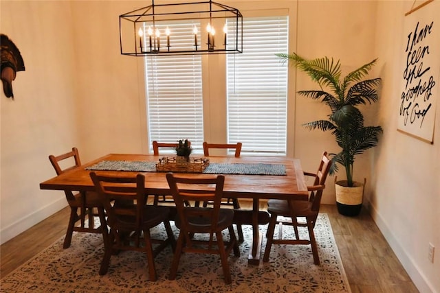 4020 Brownway Dr, College Station, TX 77845 - dining area with a chandelier and wood finished floors