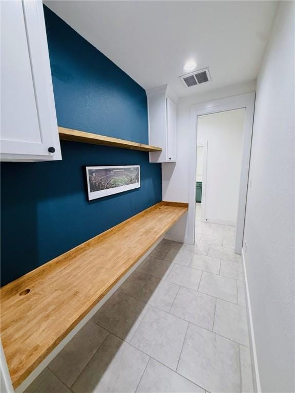 4020 Brownway Dr, College Station, TX 77845 - hall featuring baseboards and light tile patterned floors