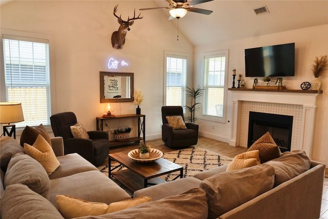 4020 Brownway Dr, College Station, TX 77845 - living room with a ceiling fan, wood finished floors, a fireplace, and lofted ceiling