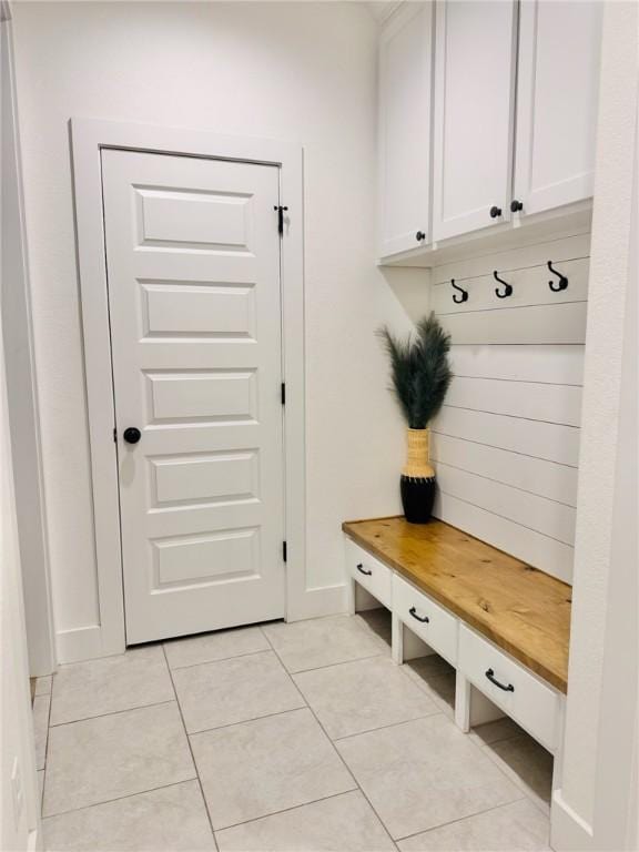 4020 Brownway Dr, College Station, TX 77845 - mudroom with light tile patterned floors and baseboards