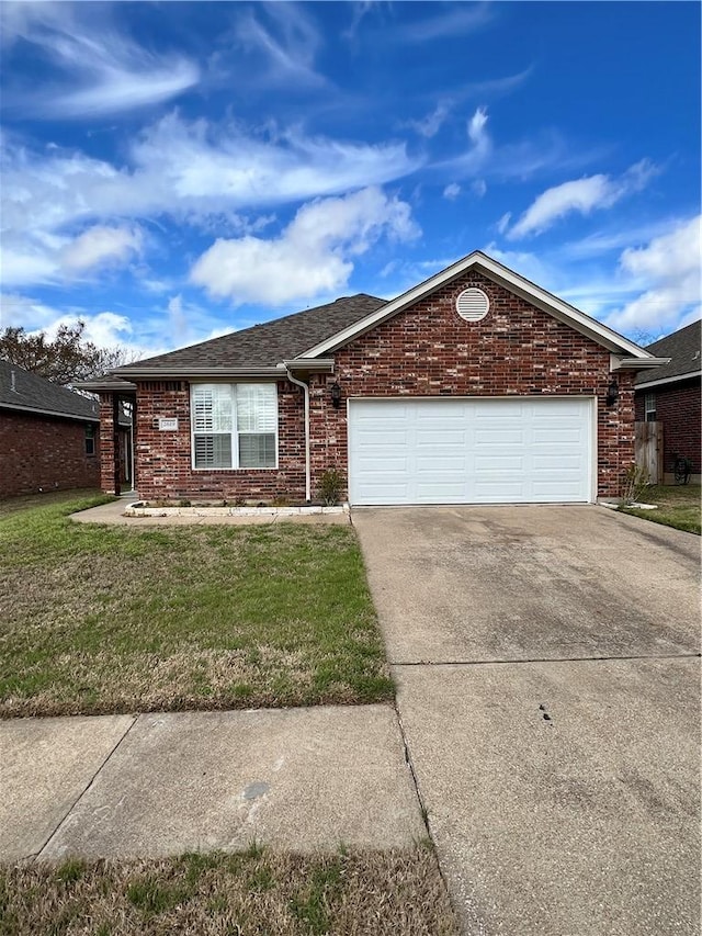 single story home with brick siding, roof with shingles, concrete driveway, an attached garage, and a front lawn