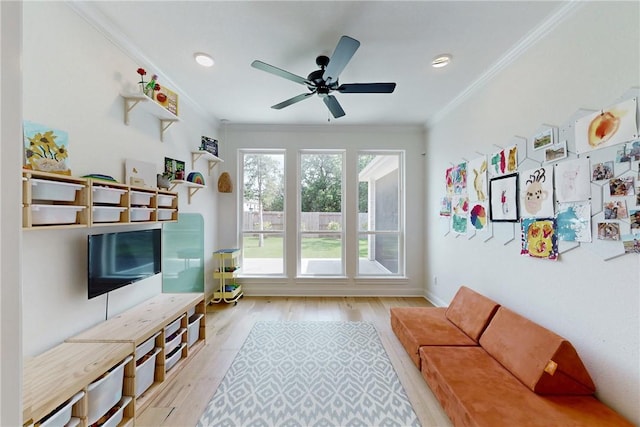 unfurnished living room with a ceiling fan, ornamental molding, recessed lighting, and wood finished floors