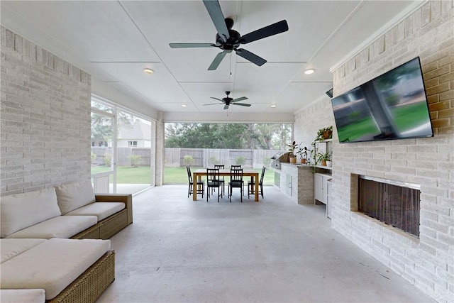 view of patio / terrace with a ceiling fan, outdoor dining area, area for grilling, outdoor lounge area, and fence