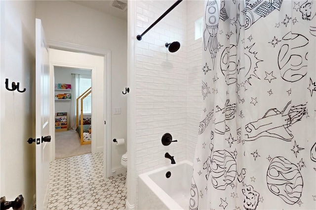 full bath with toilet, visible vents, shower / bath combo, tile patterned floors, and baseboards