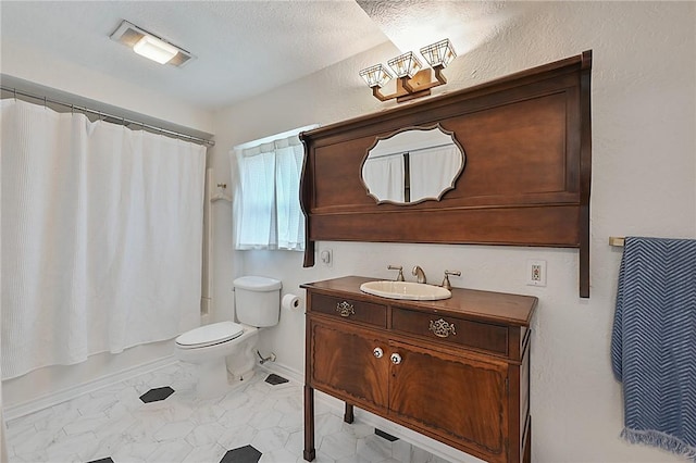 809 Coulter Dr S, Bryan, TX 77803 - full bathroom featuring shower / bath combo, toilet, a textured ceiling, and vanity