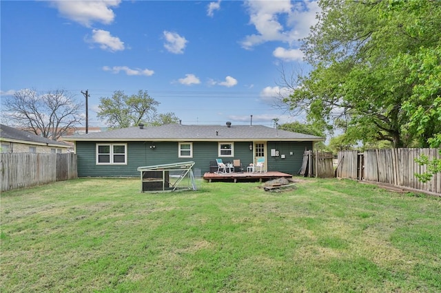 809 Coulter Dr S, Bryan, TX 77803 - back of house featuring a wooden deck and a yard