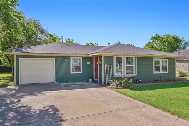 single story home featuring a front lawn and a garage