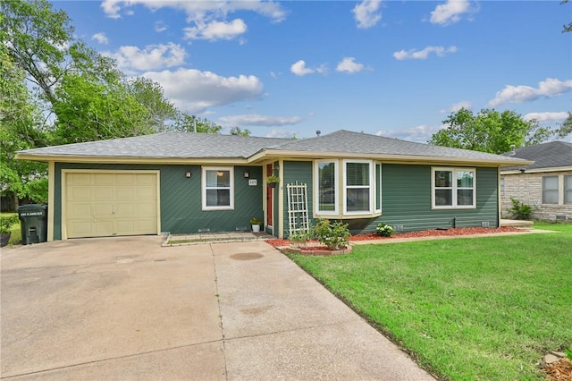 single story home with a garage and a front lawn