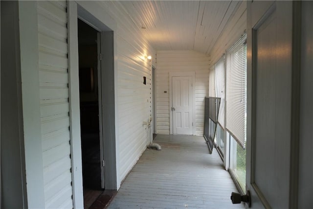 608 W 27th St, Bryan, TX 77803 - corridor with hardwood / wood-style floors, wooden ceiling, and wood walls