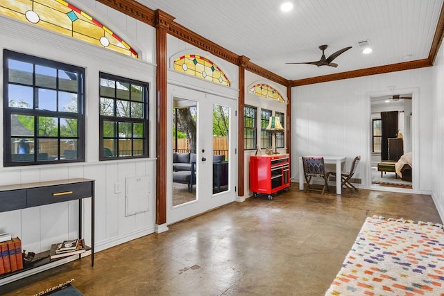 entryway featuring concrete flooring, ceiling fan, french doors, and crown molding