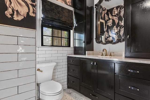 bathroom with tile patterned floors, vanity, and toilet