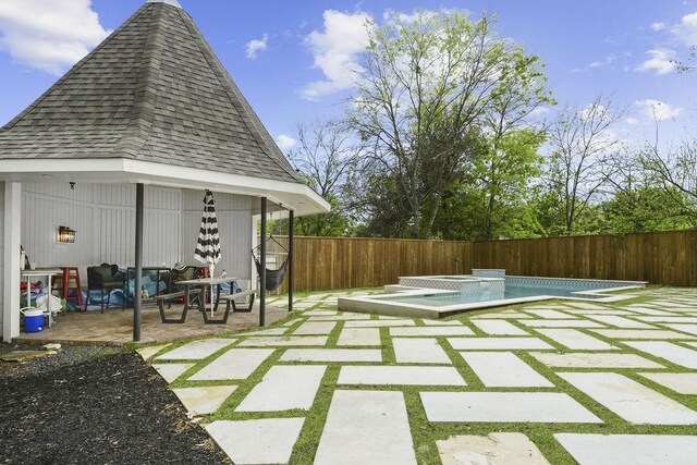 view of pool featuring a gazebo and a patio